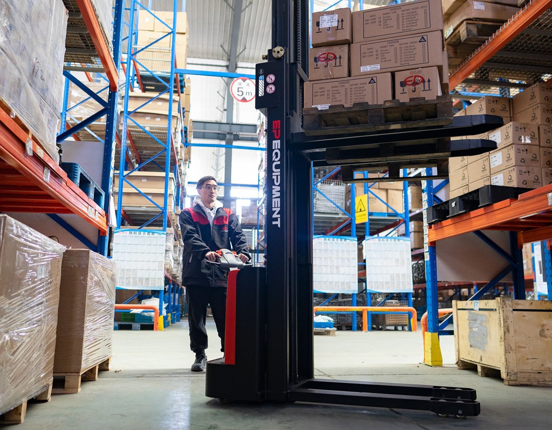 Front angled view of a red and black EP ESl122 electric stacker truck, featuring tall lifting masts and a compact handle design, positioned on a white background