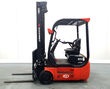 A side view of a red and black electric forklift with a comfortable seat and raised forks, set against a neutral background.