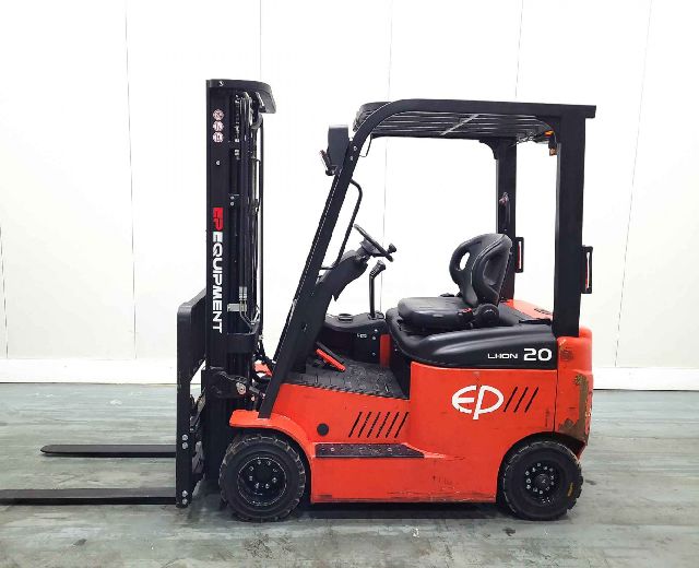 A side view of a red EP Lion 20 electric forklift, featuring an operator's seat and upright forks for material handling.