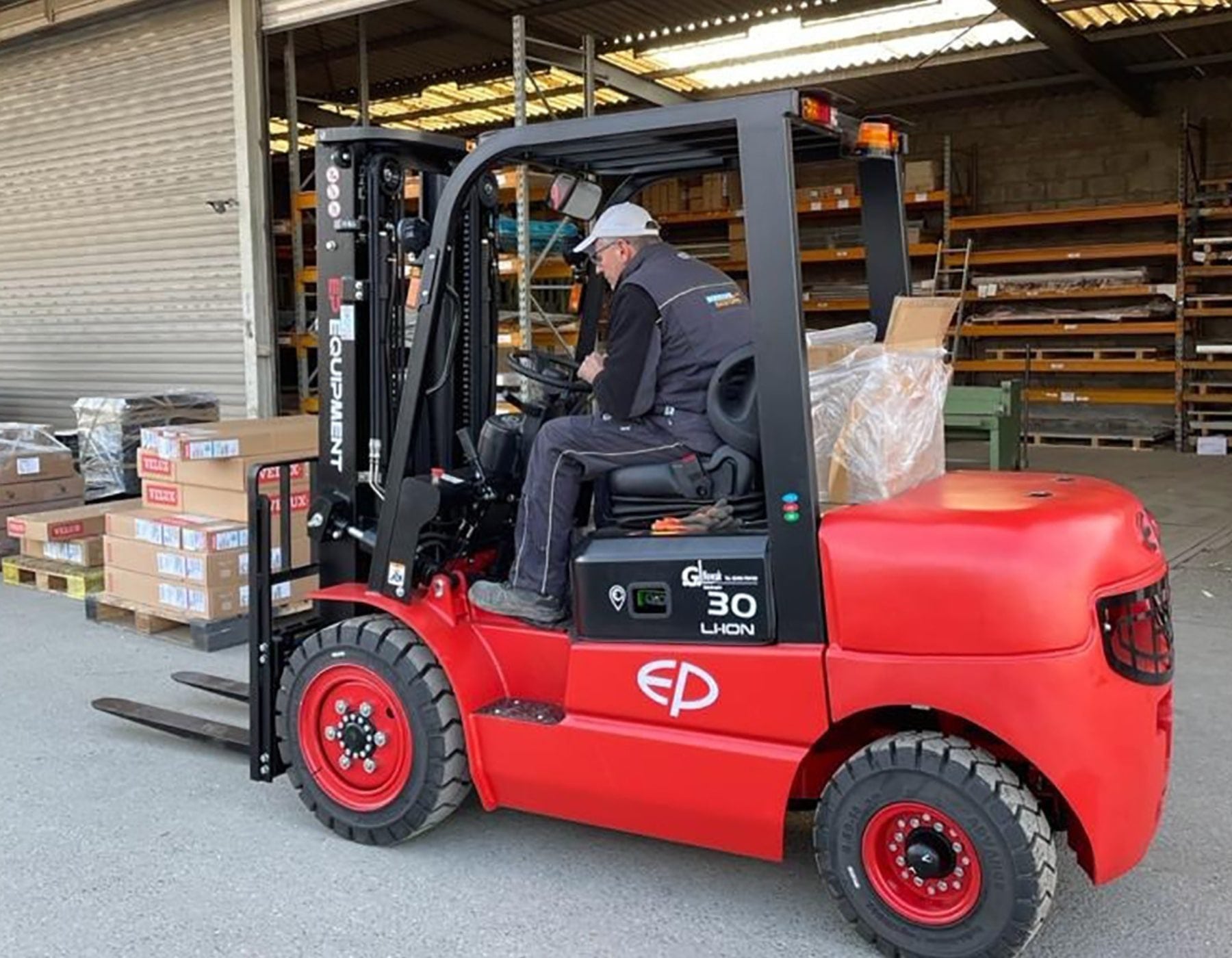 f EP Equipment forklifts and pallet trucks in industrial and warehouse settings