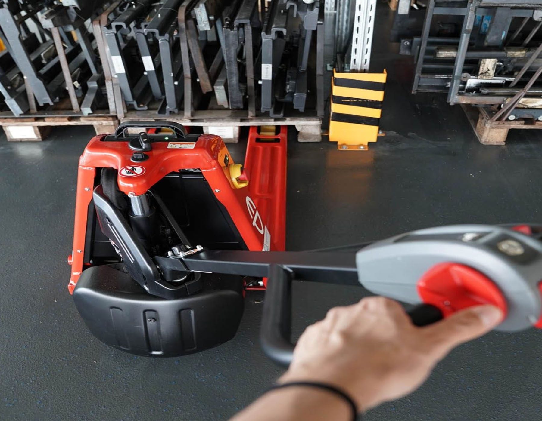 Side view of a red EP electric pallet truck labeled 'EPL1531 Li-ion,' featuring extended forks and a streamlined design, displayed on a white background